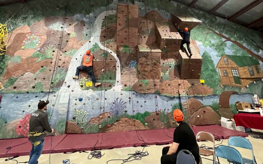 snowboarders and skiers for christ rock climbing at the mid-atlantic conference